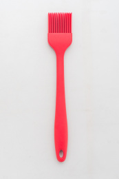 一只红色的食品级硅胶油刷