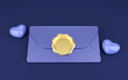 带金色印泥的蓝色商务信封与蓝色爱心书信