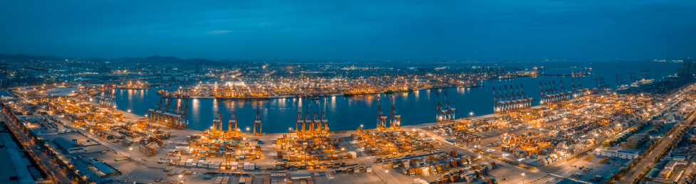 中国山东青岛港集装箱货运码头夜晚航拍全景