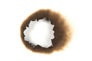 烧焦的白纸纸洞