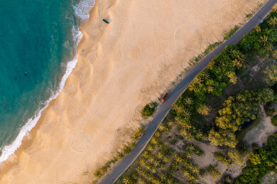 航拍海南万宁日月湾海边椰林公路