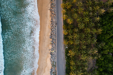 航拍海南万宁日月湾海边椰林公路
