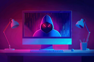 一个黑客人像显示在电脑显示屏上，网络安全