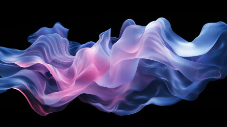 彩色颜料在黑色背景下飞溅的特写镜头