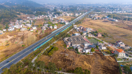 航拍广东梅州晴天现代化高速路与围龙屋