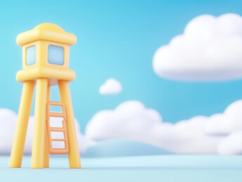 黄色瞭望塔在蓝天白云下