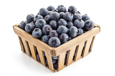 正上方白色背景的容器中的蓝莓照片