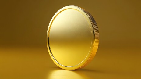 金色圆形硬币置于金色背景