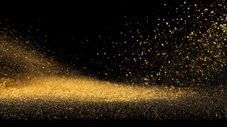 黑色背景下喷溅的金粉