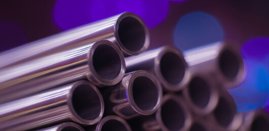 金属管材堆叠紫光背景