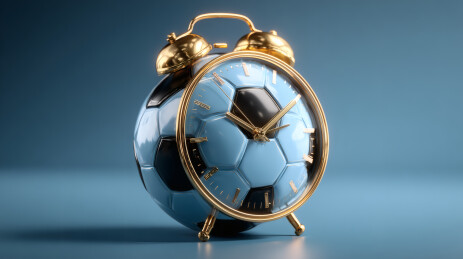 蓝色背景中的球型闹钟