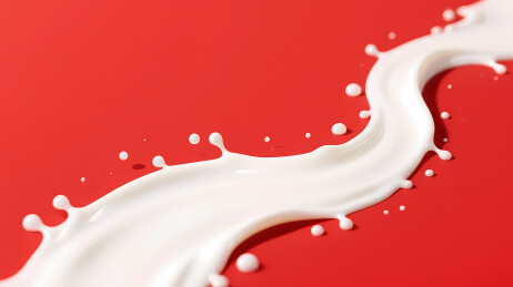 白色牛奶流动红色背景