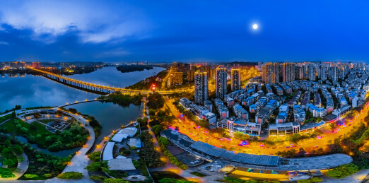 中国四川省夜晚月亮遂宁市城区高楼大厦建筑