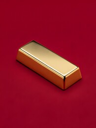 红色背景上的金色长方体金条