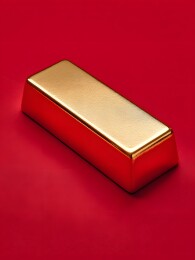 红色背景上的金色长方体金条