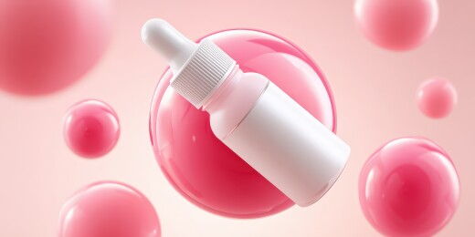 粉色背景中的白色滴管瓶