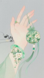手戴玉镯悬挂花饰