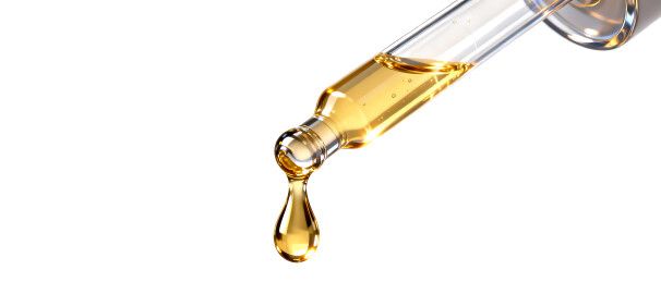 滴管里的黄金精华液背景