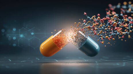 爆炸的黄蓝色药丸胶囊与彩色元素