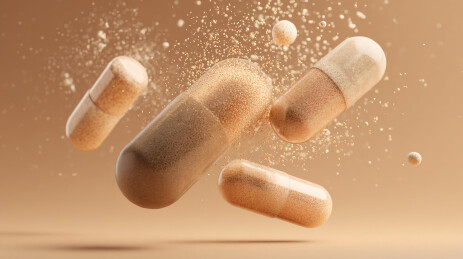 悬浮的浅棕色胶囊药物颗粒场景