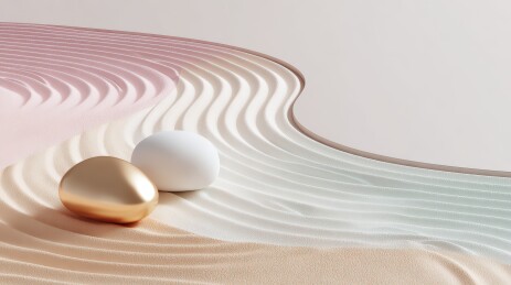 色彩柔和的波纹表面上的两颗蛋形物体