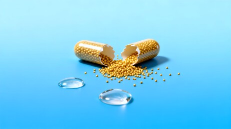 药丸胶囊散落蓝色背景