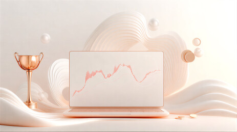 带有金融图表的笔记本电脑与奖杯