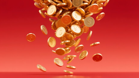 金色硬币洒落红背景