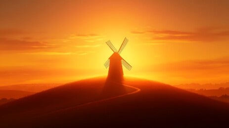 夕阳余晖中的风车剪影