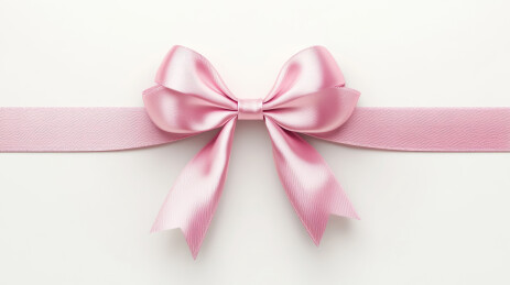 白色背景上的粉色丝绸蝴蝶结饰品