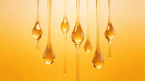 金黄液滴垂落光影