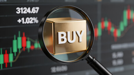 金色立体Buy字样与股票K线图