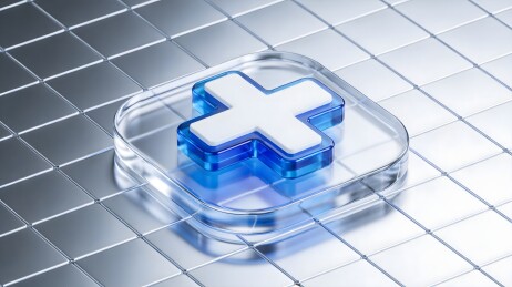 蓝色十字图标置于金属网格之上