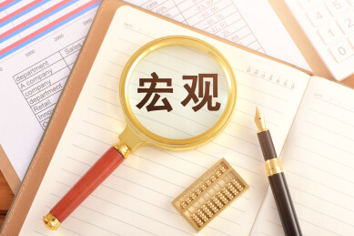 数据图表上的放大镜印着文字宏观