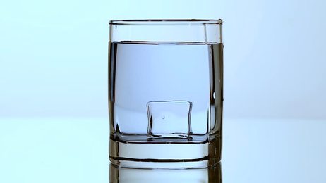 pouringglassofwaterinslowmotiononwhitebackgroundfullhdvideoshot