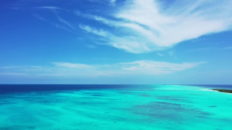 beautifulgirlrestsinthehamacabovebluewaterofindianoceanin