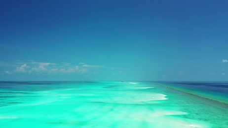 beautifulgirlrestsinthehamacabovebluewaterofindianoceanin