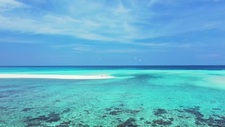 beautifulgirlrestsinthehamacabovebluewaterofindianoceanin