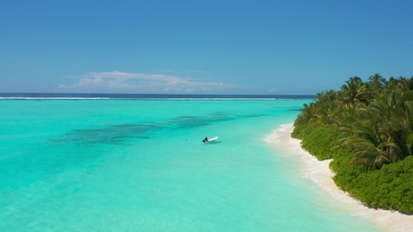 beautifulgirlrestsinthehamacabovebluewaterofindianoceanin