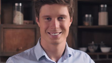 hungryyoungmangreedilyeatinghamburgerandfrenchfriesinfastfood