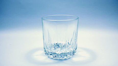 pouringglassofwaterinslowmotiononwhitebackgroundfullhdvideoshot